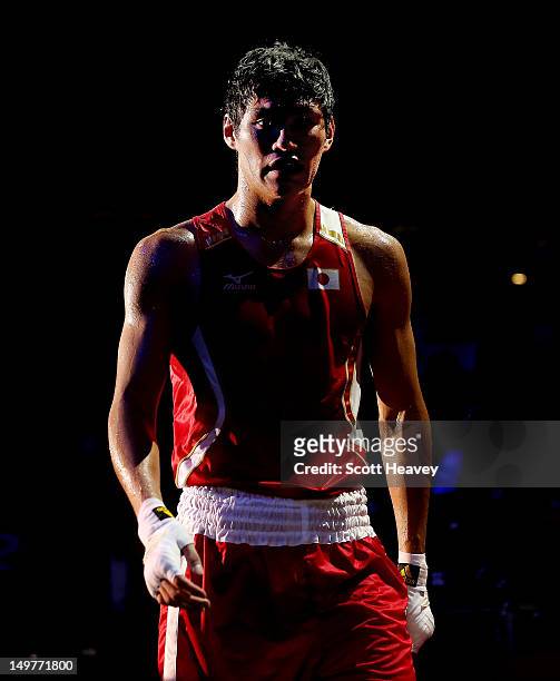 Yasuhiro Suzuki of Japan after his defeat to Serik Sapiyev of Kazakhstan during the Men's Welter Boxing on Day 7 of the London 2012 Olympic Games at...