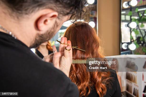 the hairdresser is cutting out hair - cutting long hair stock pictures, royalty-free photos & images