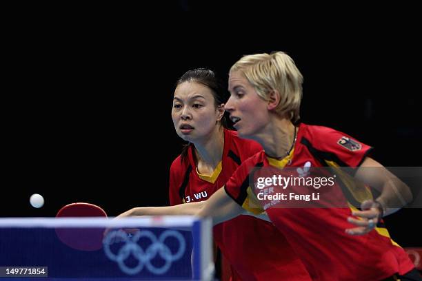 Jiaduo Wu and Kristin Silbereisen of Germany complete during Women's Team Table Tennis first round match against team of Australia on Day 7 of the...