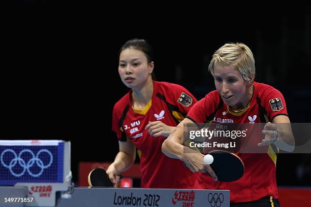 Jiaduo Wu and Kristin Silbereisen of Germany complete during Women's Team Table Tennis first round match against team of Australia on Day 7 of the...