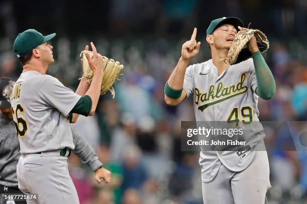Ryan Noda and Sam Long of the Oakland Athletics celebrate after an 8-6 win over the Milwaukee Brewers and sweeping the three-game series at American...