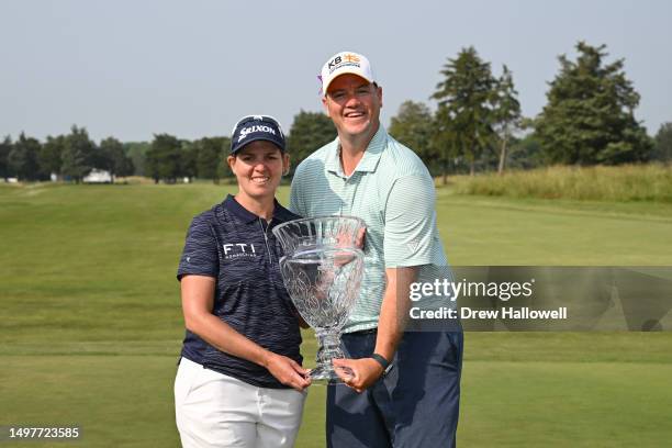 Ashleigh Buhai of South Africa poses for a photo with her husband David and the trophy after winning the ShopRite LPGA Classic presented by Acer at...