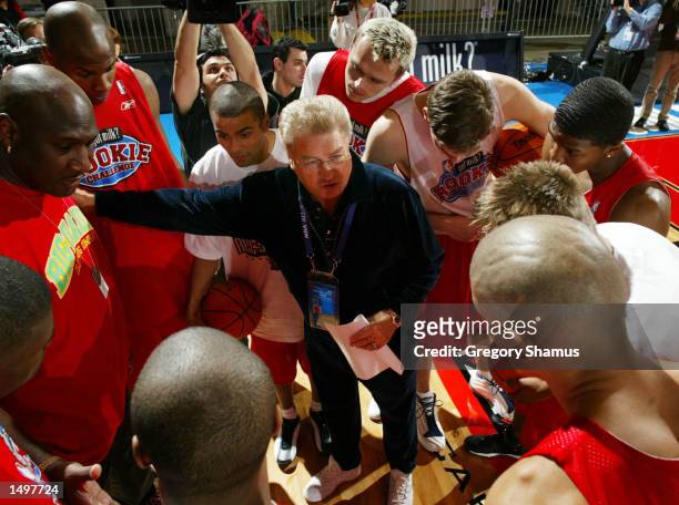 Rookie team head coach Chuck Daly talks with his team during their practice time at the NBA Jam Session Center Court in Philadelphia, Pennsylvania....