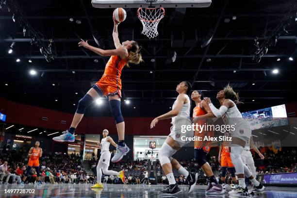 Rebecca Allen of the Connecticut Sun shoots over Nia Coffey of the Atlanta Dream during the second half at Gateway Center Arena on June 11, 2023 in...