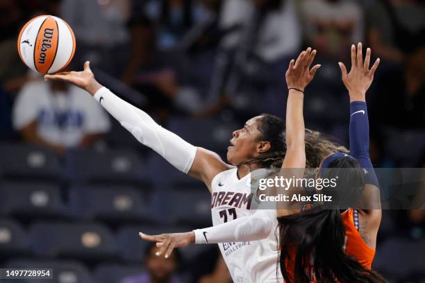 Cheyenne Parker of the Atlanta Dream shoots over DiJonai Carrington of the Connecticut Sun during the second half at Gateway Center Arena on June 11,...