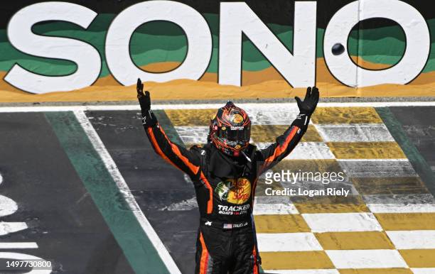 Martin Truex Jr., driver of the Bass Pro Shops Toyota, celebrates after winning the NASCAR Cup Series Toyota / Save Mart 350 at Sonoma Raceway on...