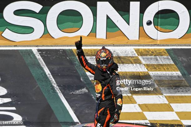 Martin Truex Jr., driver of the Bass Pro Shops Toyota, celebrates after winning the NASCAR Cup Series Toyota / Save Mart 350 at Sonoma Raceway on...