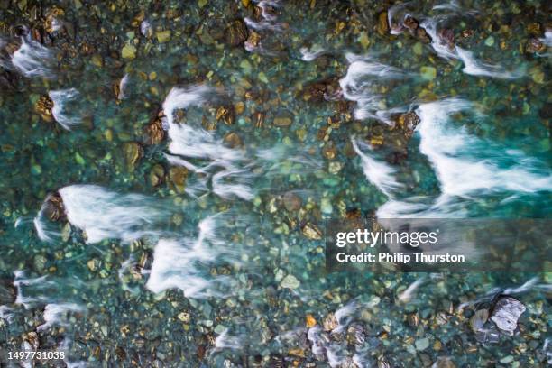 directly above looking down at rushing rapid river from snowmelt in the mountains - verdigris river bildbanksfoton och bilder