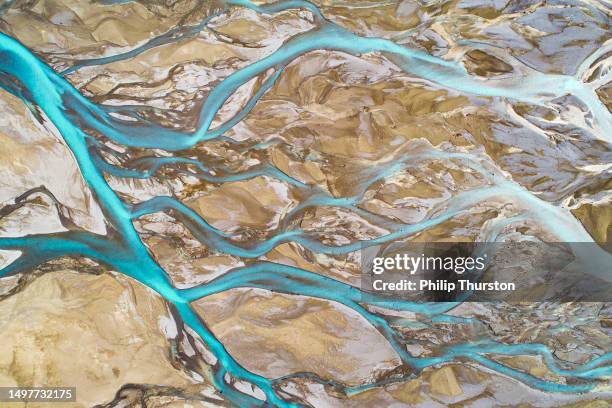 aerial perspective of river braid system from glacial runoff - braided river stock pictures, royalty-free photos & images