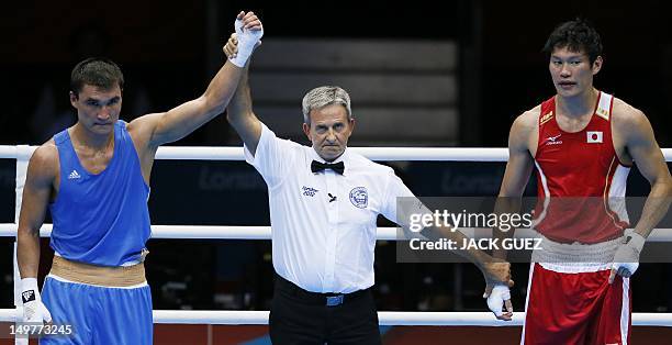 Serik Sapiyev of Kazakhstan is declared victor over Yasuhiro Suzuki of Japan in their round of 16 Welterweight match of the London 2012 Olympic Games...