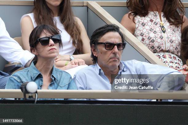 Charlotte Gainsbourg and Yvan Attal attend the 2023 French Open at Roland Garros on June 11, 2023 in Paris, France.