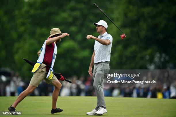 Nick Taylor of Canada tosses his club in celebration after making an eagle putt on the 4th playoff hole to win the RBC Canadian Open at Oakdale Golf...