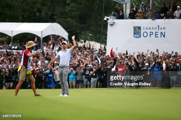 Nick Taylor of Canada tosses his club in celebration after making an eagle putt on the 4th playoff hole to win the RBC Canadian Open at Oakdale Golf...