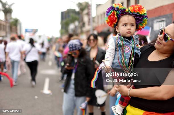 Young spectator is dressed in pride colors during the 2023 LA Pride Parade in Hollywood on June 11, 2023 in Los Angeles, California. The annual...