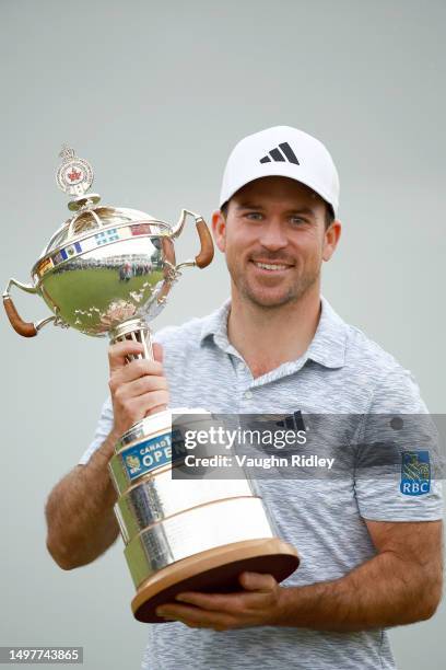 Nick Taylor of Canada holds the trophy after winning the RBC Canadian Open at Oakdale Golf & Country Club on June 11, 2023 in Toronto, Ontario.