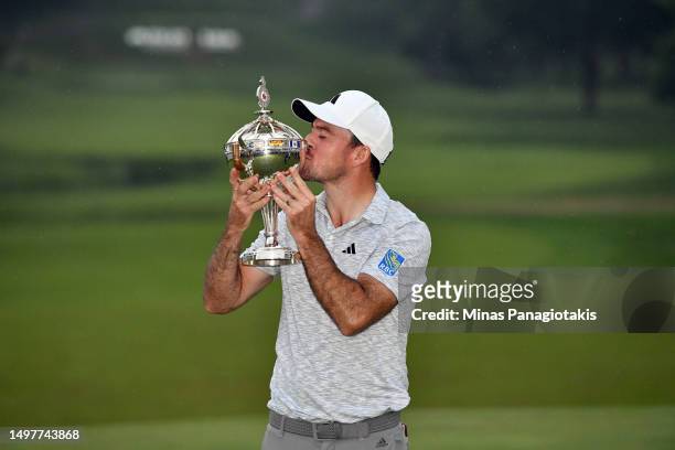 Nick Taylor of Canada holds the trophy after winning the RBC Canadian Open at Oakdale Golf & Country Club on June 11, 2023 in Toronto, Ontario.