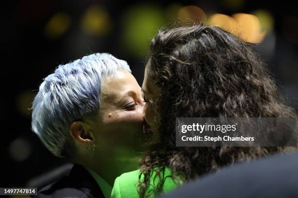 June 11: Megan Rapinoe and Sue Bird kiss after Sue Bird's jersey retirement ceremony after the game between the Seattle Storm and the Washington...