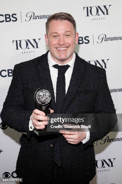 Michael Arden poses with the award for Best Direction of a Musical for "Parade" in the press room during The 76th Annual Tony Awards at Radio Hotel...