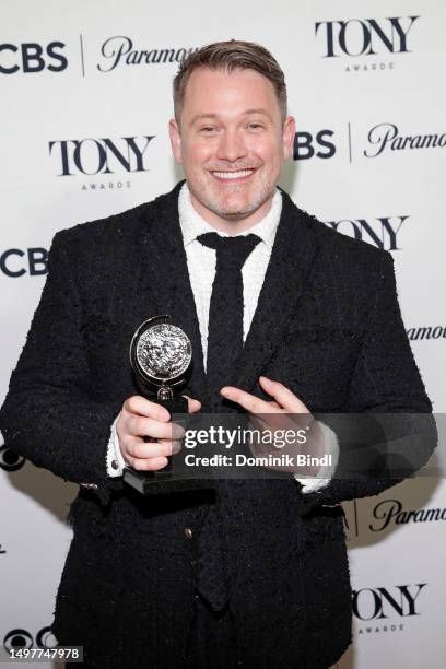 Michael Arden poses with the award for Best Direction of a Musical for "Parade" in the press room during The 76th Annual Tony Awards at Radio Hotel...