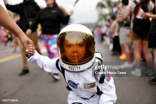 Young participant marches dressed as a NASA astronaut during the 2023 LA Pride Parade in Hollywood on June 11, 2023 in Los Angeles, California. The...