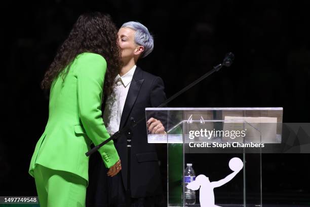 Sue Bird kisses her partner Megan Rapinoe during her jersey retirement ceremony after the game between the Seattle Storm and the Washington Mystics...