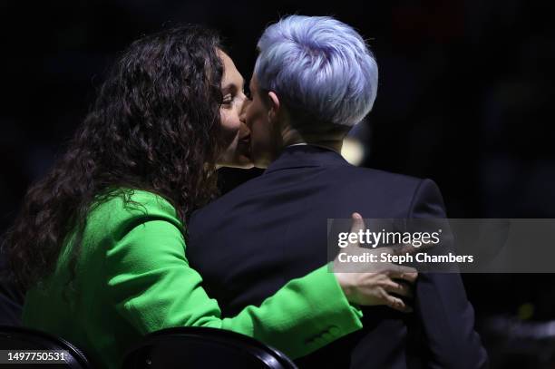 Sue Bird kisses her partner Megan Rapinoe during her jersey retirement ceremony after the game between the Seattle Storm and the Washington Mystics...