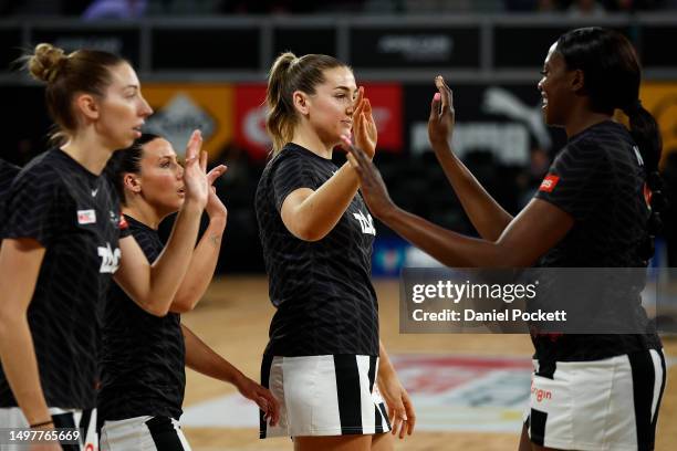 The Magpies warm up before the round 13 Super Netball match between Melbourne Vixens and Collingwood Magpies at John Cain Arena, on June 12 in...