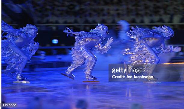 Performers skate across the ice at the Opening Ceremony of the Salt Lake City Winter Olympic Games at the Rice-Eccles Olympic Stadium in Salt Lake...