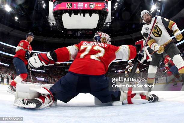 Goaltender Sergei Bobrovsky of the Florida Panthers makes a save in front of Mark Stone of the Vegas Golden Knights during the third period of Game...