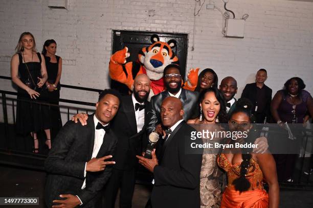 Tony the Tiger® celebrates with Corey Hawkins, Common, Uzo Aduba, Kenny Leon, Debra Martin Chase and LaChanze backstage at the 76th Annual Tony...