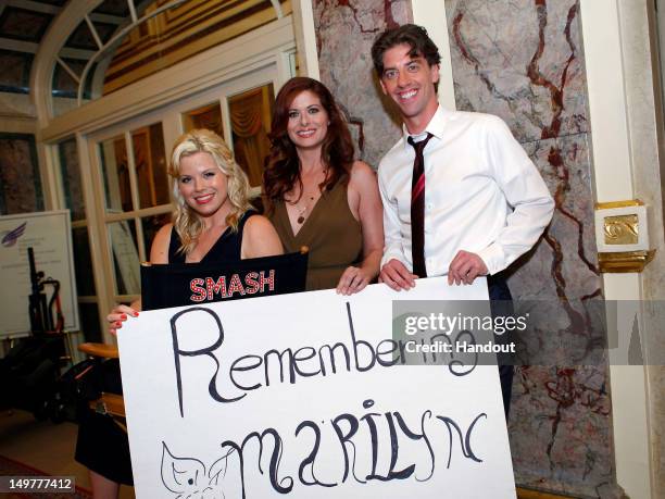 In this handout photo provided by NBCUniversal Media, "Smash" cast members Megan Hilty, Debra Messing and Christian Borle commemorate the 50th...