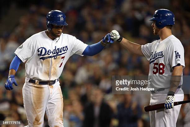 James Loney of the Los Angeles Dodgers celebrates with teammate Chad Billingsley after scoring a run against the Chicago Cubs at Dodger Stadium on...