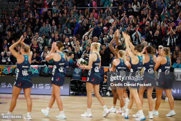 Vixens fans celebrate with the players after winning the round 13 Super Netball match between Melbourne Vixens and Collingwood Magpies at John Cain...