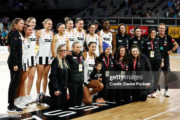 The Magpies players and staff pose for a photograph after the round 13 Super Netball match between Melbourne Vixens and Collingwood Magpies at John...