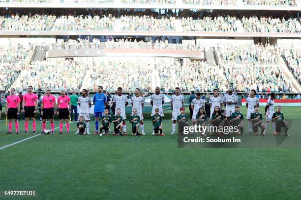 The FC Dallas stand for the the national anthem before the match against the Portland Timbers at Providence Park on June 11, 2023 in Portland, Oregon.