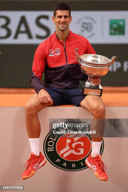 Novak Djokovic of Serbia celebrates with the winners trophy after victory against Casper Ruud of Norway in the Men's Singles Final match on Day...