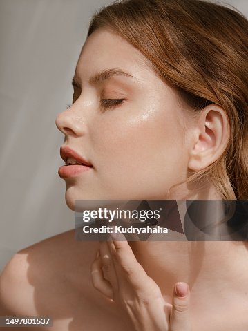 Portrait of a woman with clean, moist skin in the sunlight Portrait of a woman with clean, moist skin in the sunlight