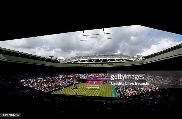 General view of Wimbledon is seen as Juan Martin Del Potro of Argentina returns a shot against Roger Federer of Switzerland in the Semifinal of Men's...