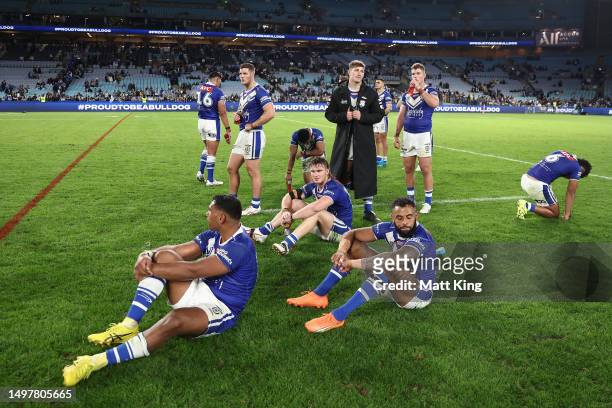 Bulldogs players react after losing the round 15 NRL match between Canterbury Bulldogs and Parramatta Eels at Accor Stadium on June 12, 2023 in...
