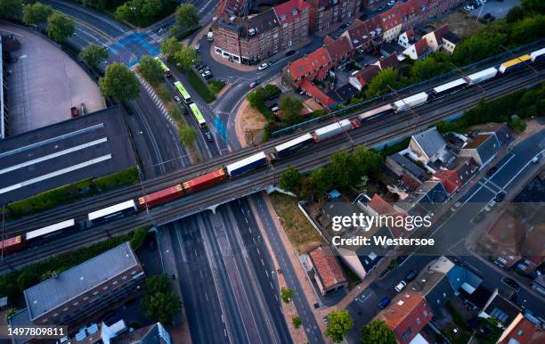 railroad track crossing main city road in odense - bus denmark stock pictures, royalty-free photos & images