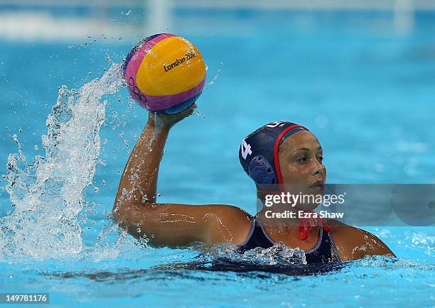 Brenda Villa of the United States looks to pass during their game against China on Day 7 of the London 2012 Olympic Games at Water Polo Arena on...