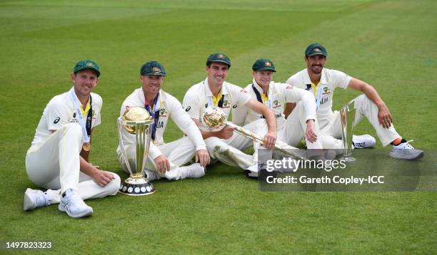 Josh Hazlewood, David Warner, Pat Cummins, Steve Smith and Mitchell Starc of Australia pose with the ICC World Cup, ICC World Test Championship Mace...