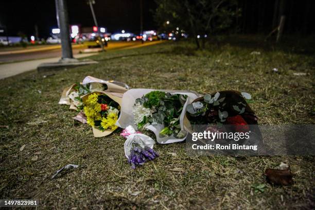 Floral tributes lie next to a road near the site of a bus crash on June 12, 2023 in Cessnock, Hunter Valley, New South Wales, Australia. A horrific...