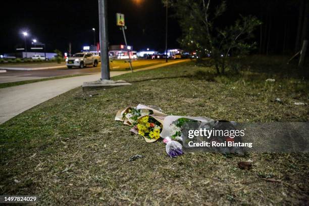 Floral tributes lie next to a road near the site of a bus crash on June 12, 2023 in Cessnock, Hunter Valley, New South Wales, Australia. A horrific...