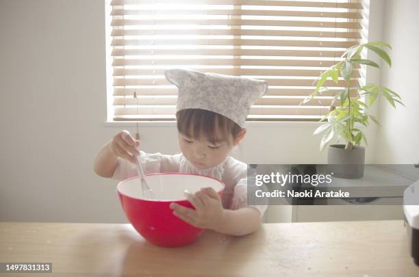 girl making cookies - ボウル stock pictures, royalty-free photos & images