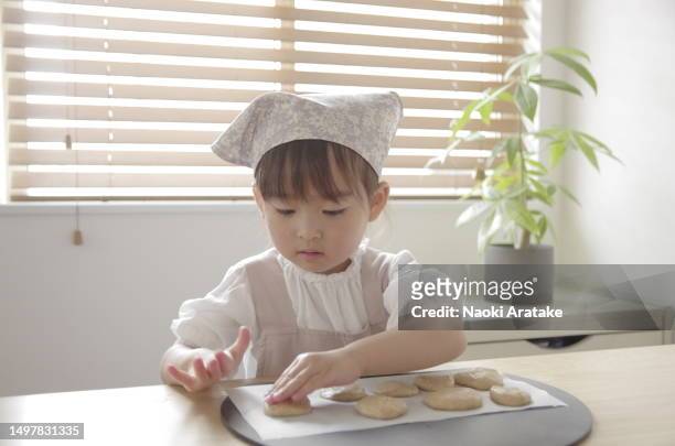 girl making cookies - 美食 stock pictures, royalty-free photos & images