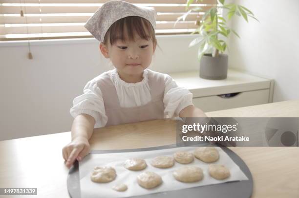 girl making cookies - 美食 stock pictures, royalty-free photos & images