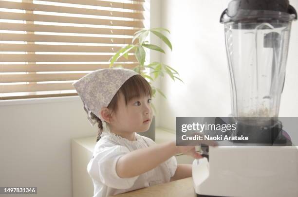 girl making cookies - ボウル stock pictures, royalty-free photos & images