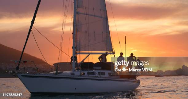 cruise, travel and luxury with people on a boat in the ocean for adventure during summer vacation or holiday. relax, ship and sailing with crew of friends on a yacht for tourism at sea - sailing ship night stock pictures, royalty-free photos & images