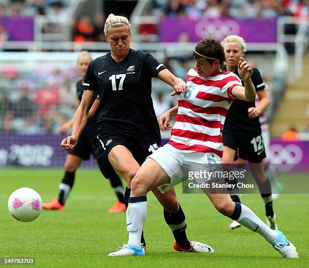 Hannah Wilkinson of New Zealand battles with Amy le Peilbet of USA during the Women's Football Quarter Final match between United States and New...
